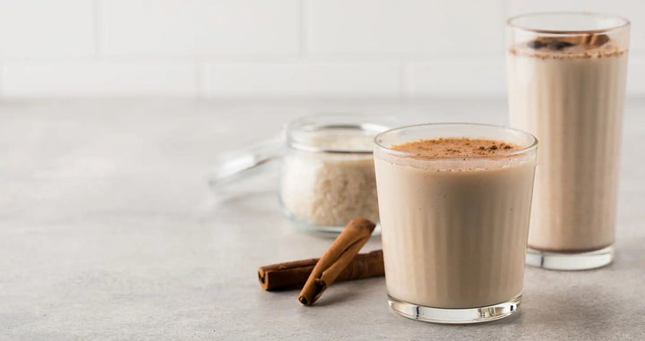 Two Leaves and a Bud Mountain High Chai Horchata image of beverage with cinnamon sticks