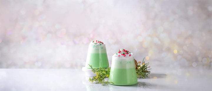 Grinch Latte, matcha latte, peppermint, whipped cream, green and white beverage, holiday drink