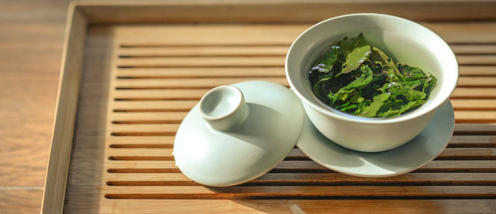 green tea on a bamboo tray