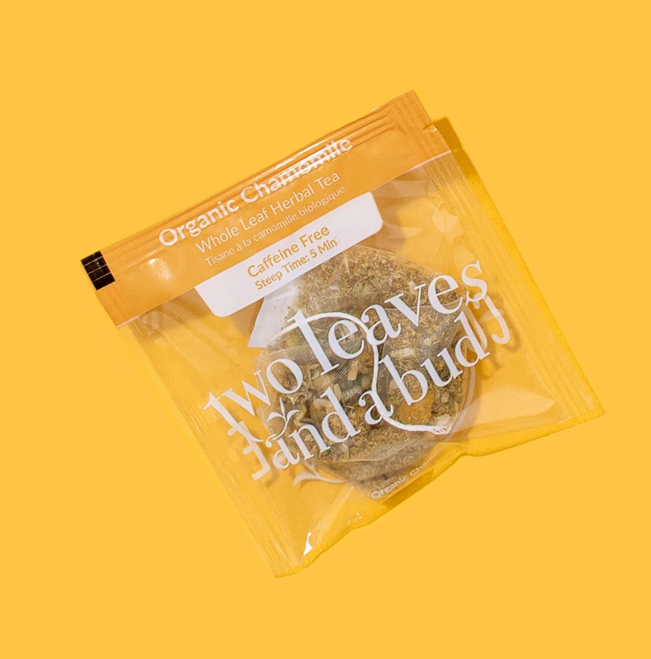 Packaged organic herbal tea with text on a yellow background