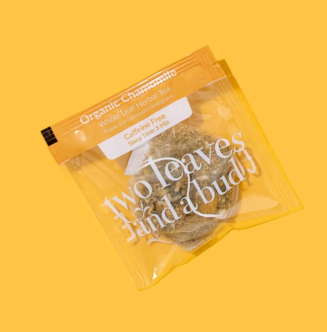 Packaged organic herbal tea with text on a yellow background