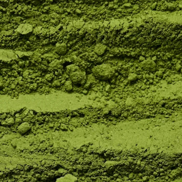 Close-up of green powder with a textured surface